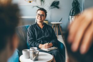 Middle aged family couple discusses relationship problems with skilled psychotherapist